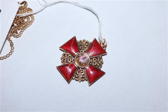 An early 20th century Russian 56 zolotnik yellow metal and enamel cross pendant and an associated 18ct chain, pendant 34mm.